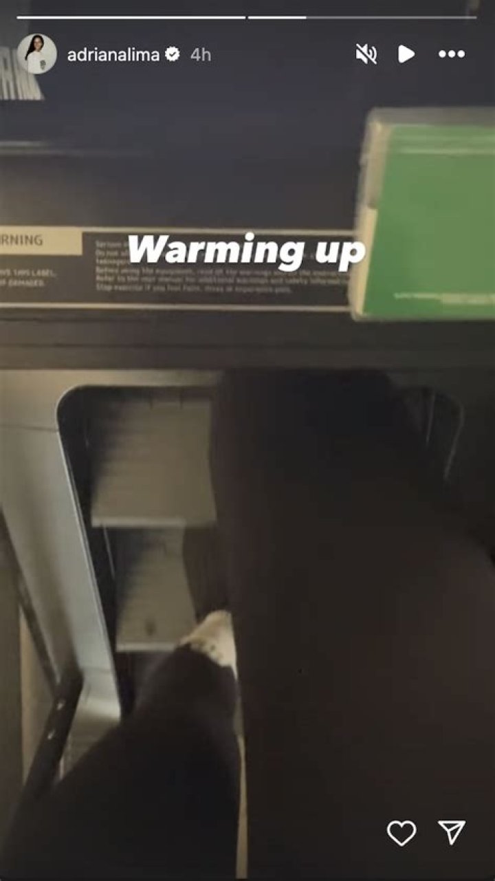 Adriana Lima in Workout Gear is "Warming Up" for Step Workout