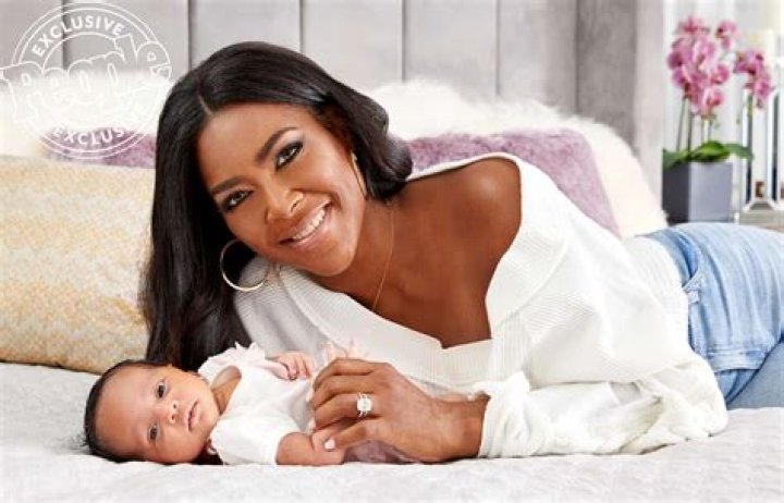 Kenya Moore Shares New Pics Of Baby Brooklyn Sneaking Up On Her Daddy, Marc Daly